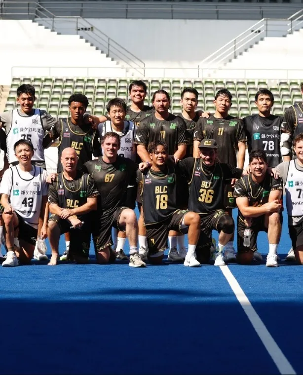 The Bangkok LC squad lined up on a blue stadium pitch